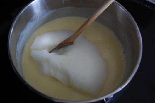 Egg whites and vanilla added to creamy milk mixture.