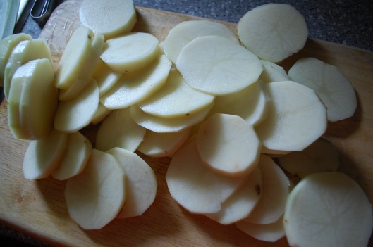 Slice your potatoes thin, but no so thin that they'll fall apart when boiled.